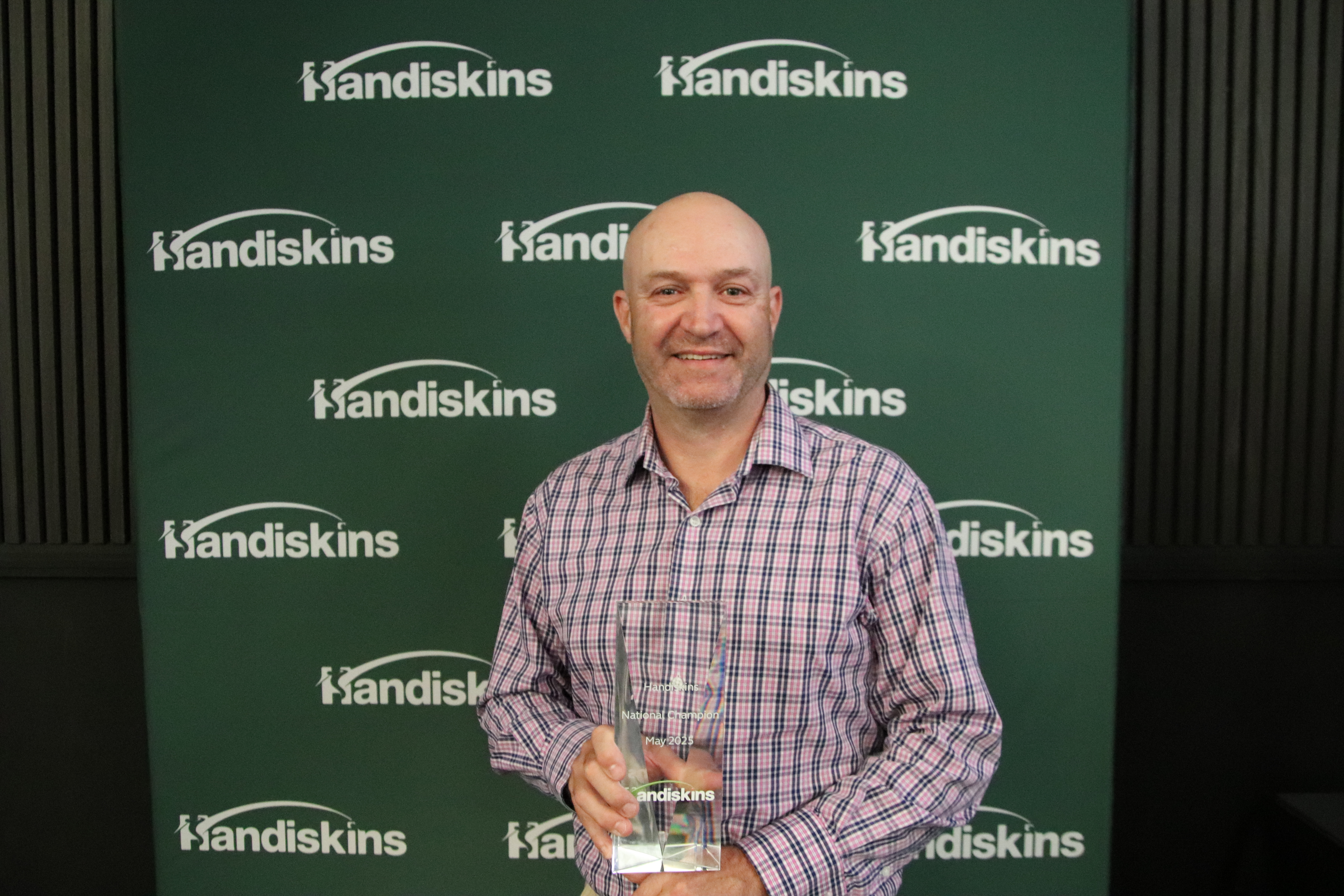 Adrian Romei with the 2025 Handiskins National Championship Trophy
